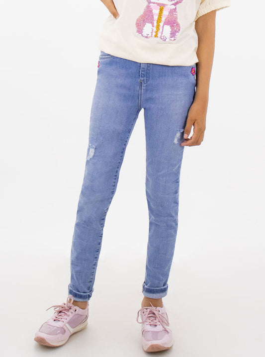 Jeans skinny con bordado floral