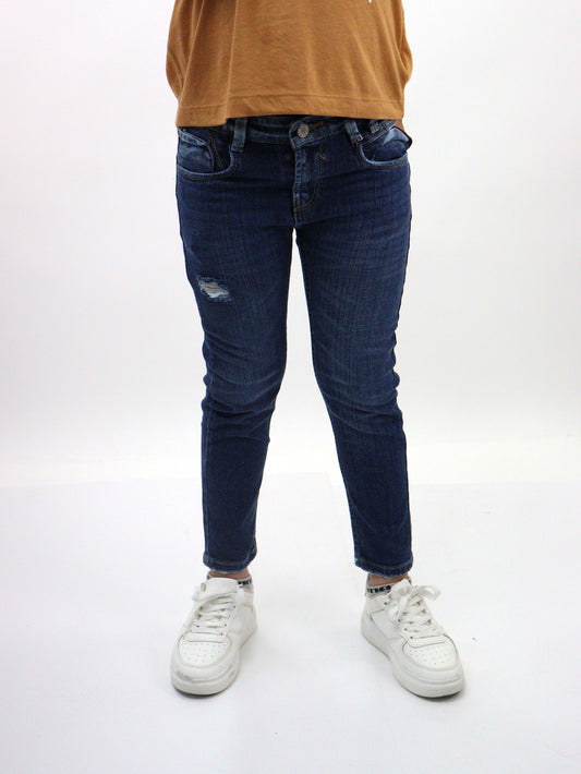 Jeans skinny de color azul oscuro con destrucción