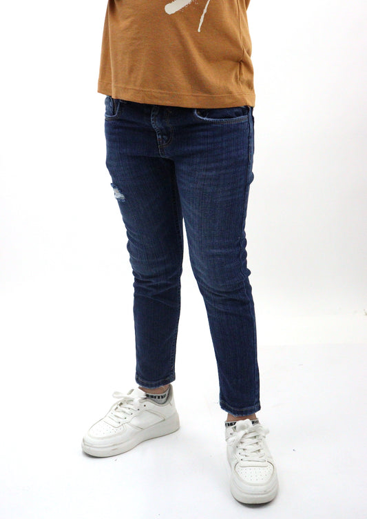 Jeans skinny de color azul oscuro con destrucción