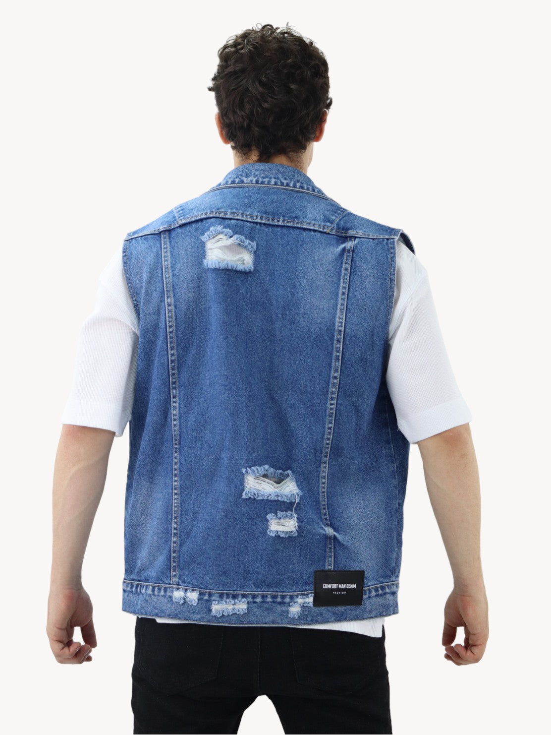 Chaleco denim de color azul oscuro con destrucción