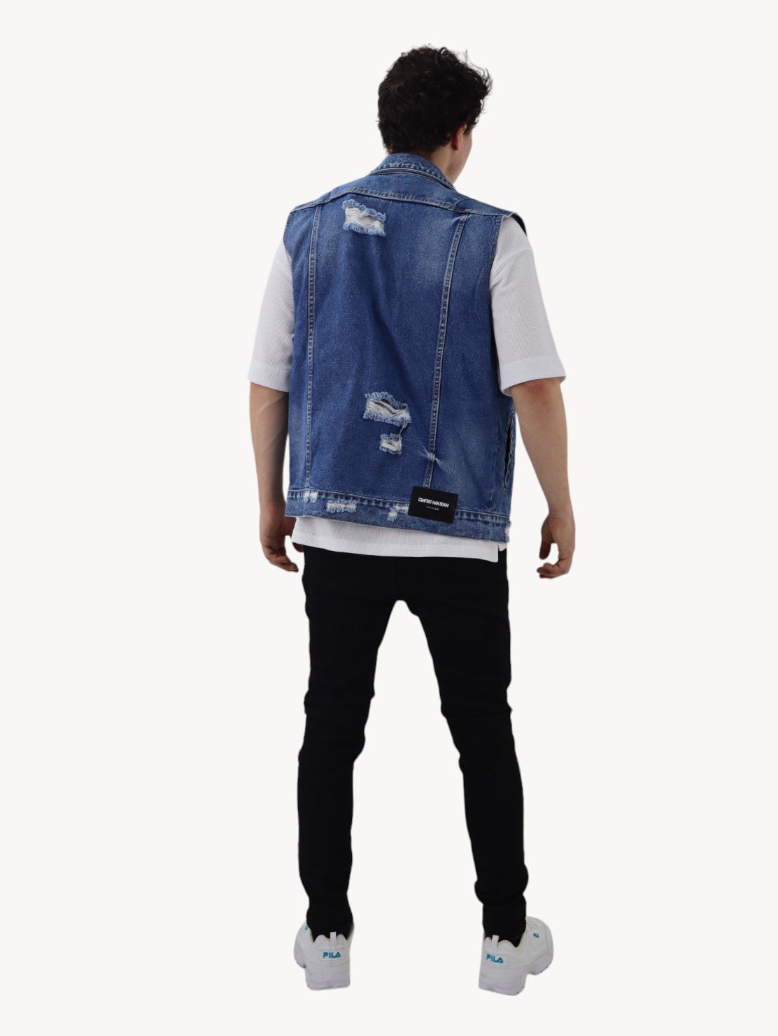 Chaleco denim de color azul oscuro con destrucción