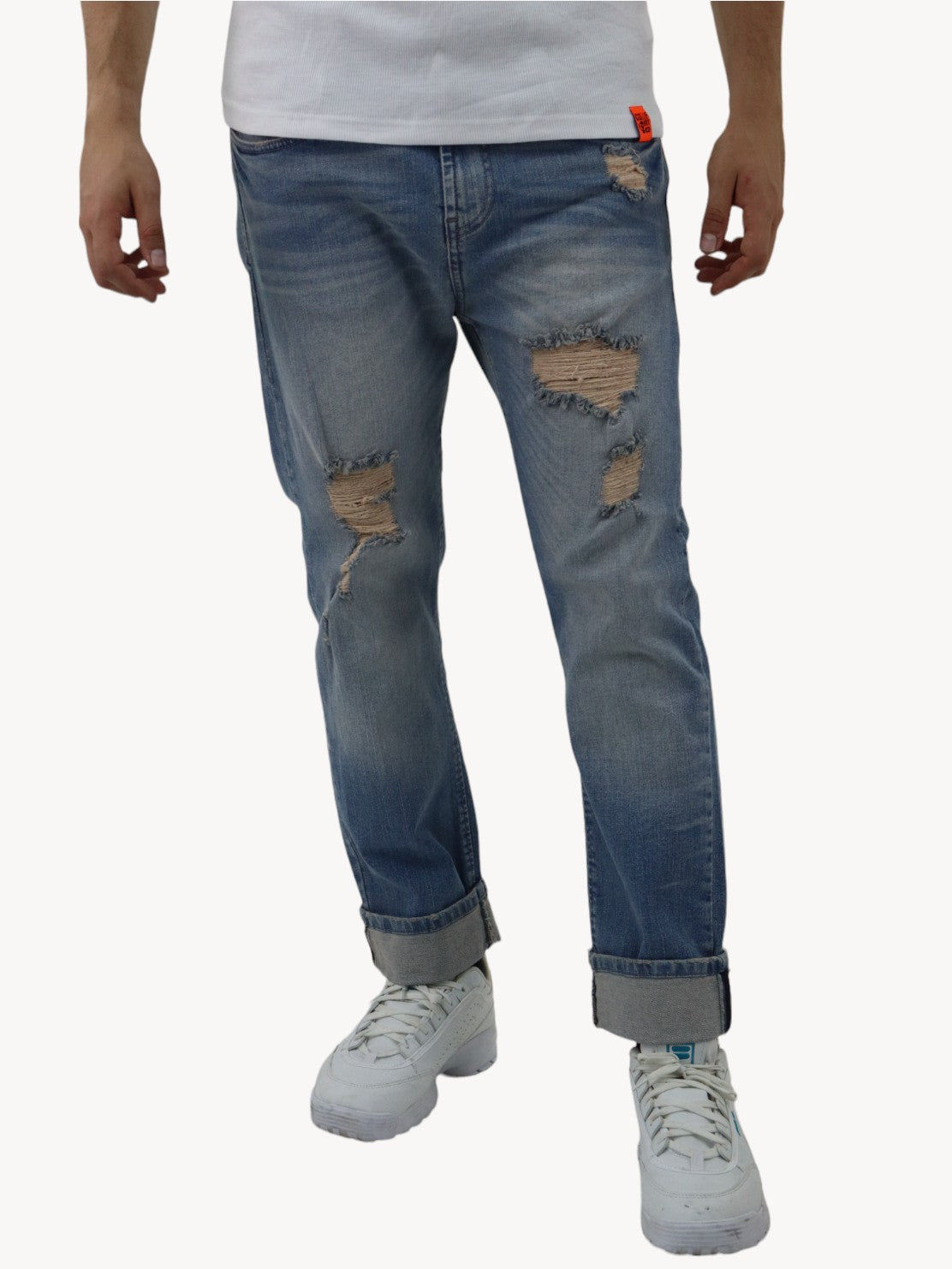 Jeans slim azul deslavado con destrucción