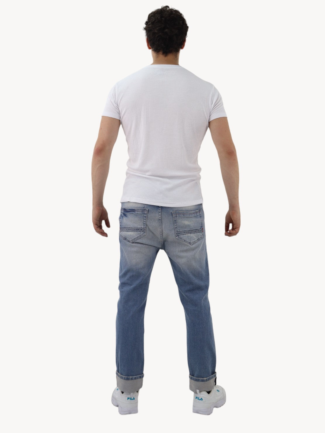 Jeans slim azul deslavado con destrucción