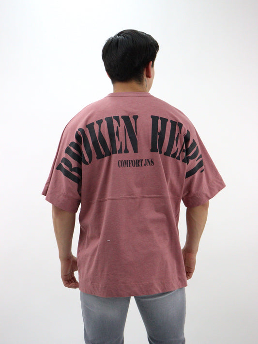 Playera oversize de color rosa palo con estampado