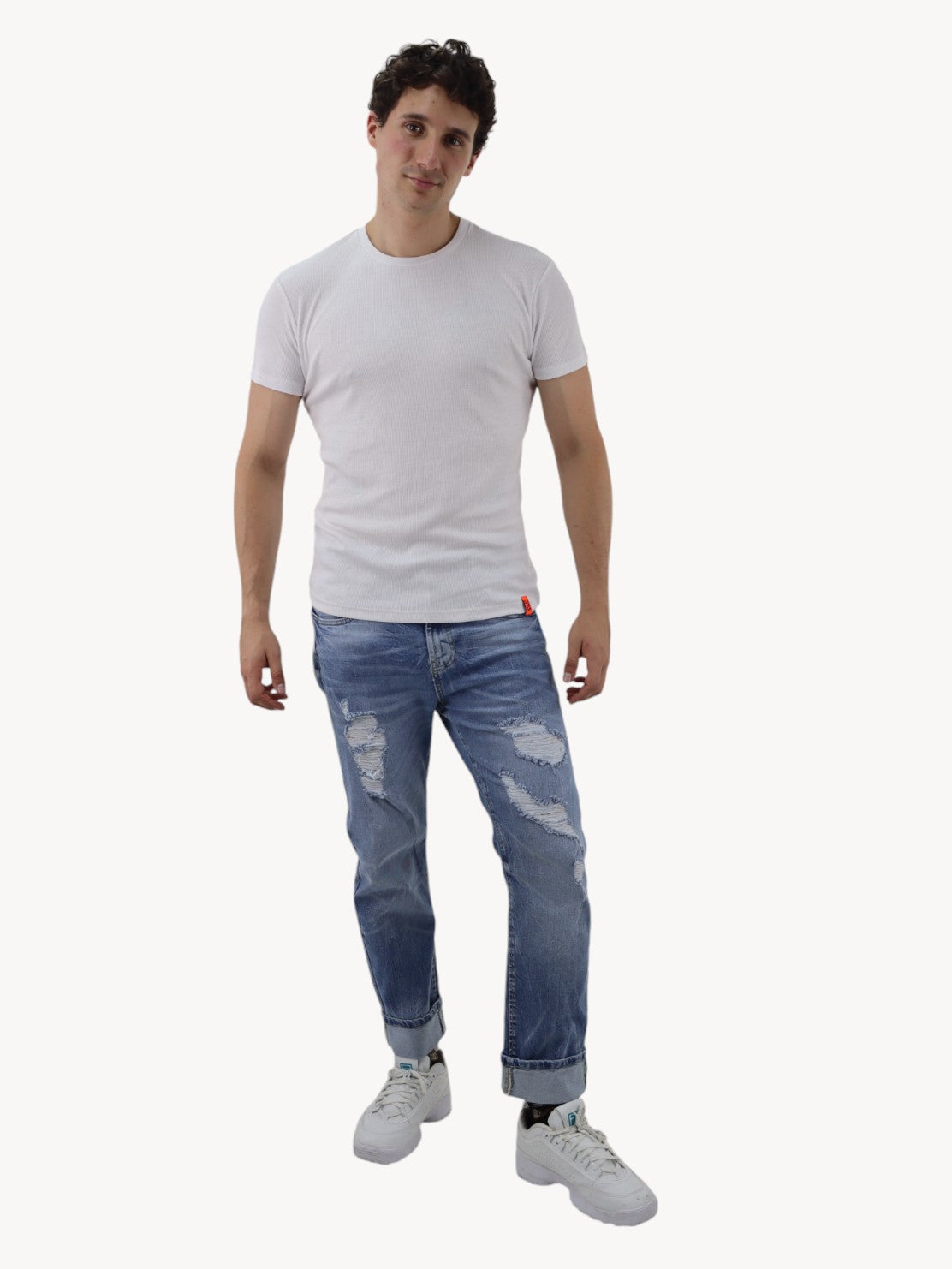 Jeans slim azul deslavado con destrucción