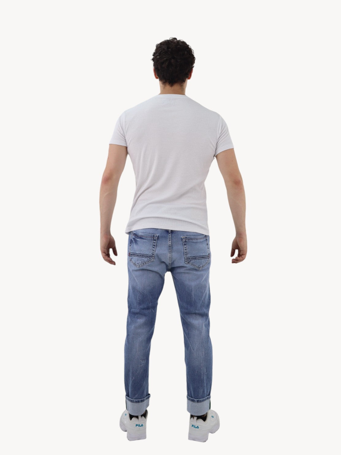 Jeans slim azul deslavado con destrucción