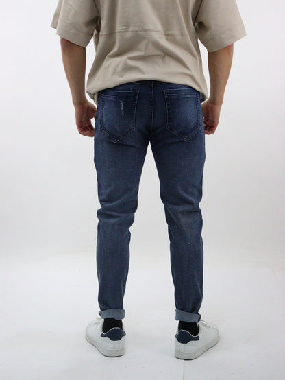 Jeans skinny de color azul oscuro con destrucción (NUEVA TEMPORADA)