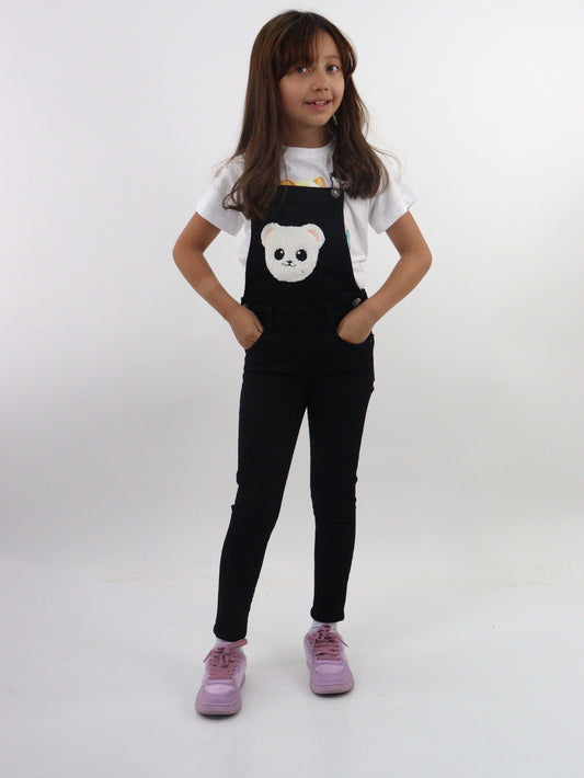 Overol denim de color negro con oso decorativo