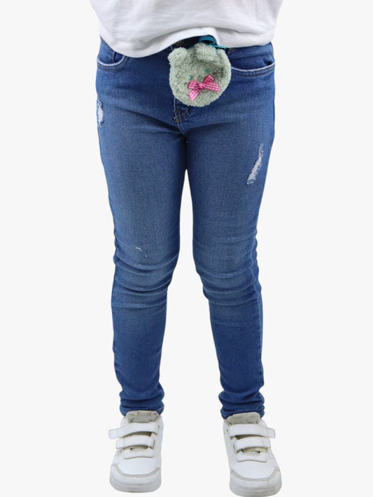 Jeans skinny de color azul medio con colgante