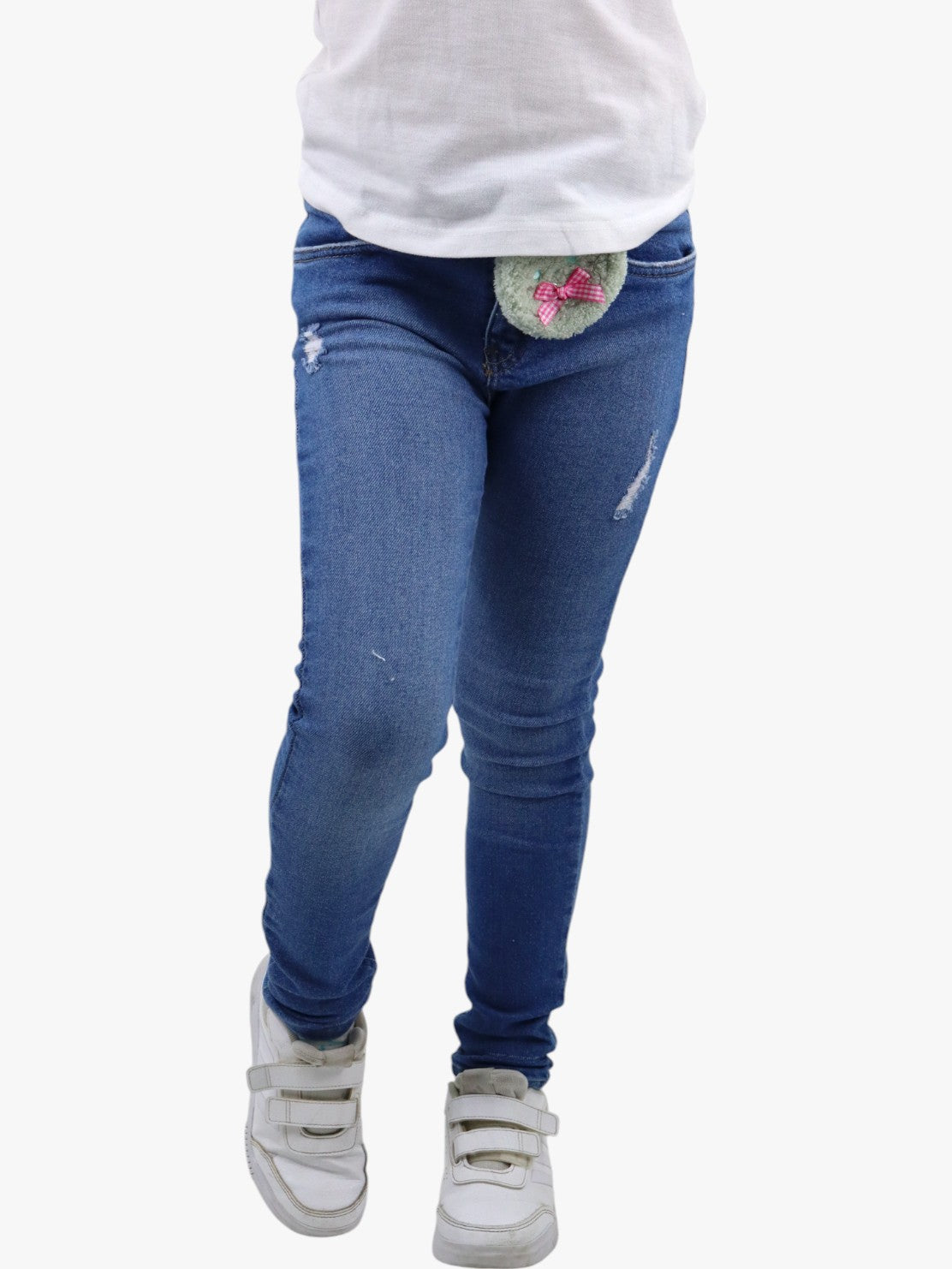 Jeans skinny de color azul medio con colgante