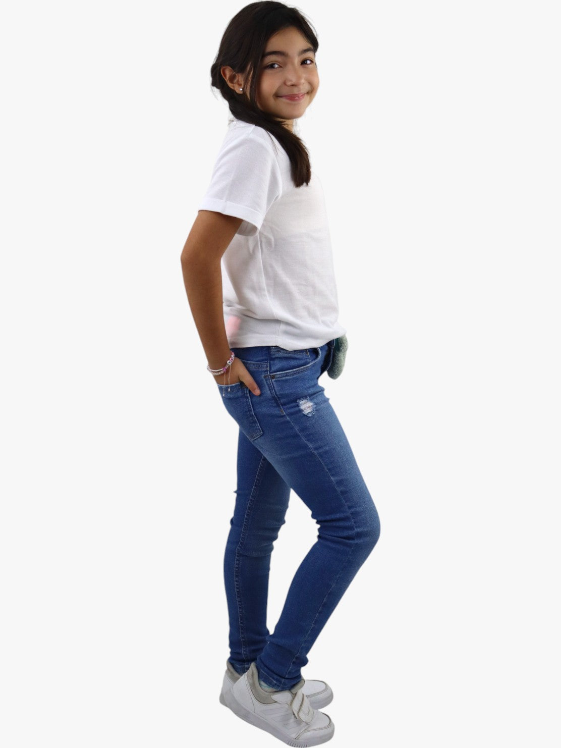 Jeans skinny de color azul medio con colgante