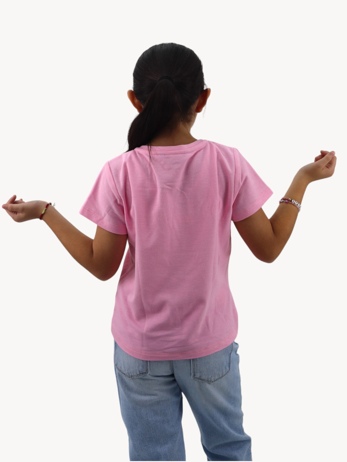 Playera manga corta color rosa con detalle de moño