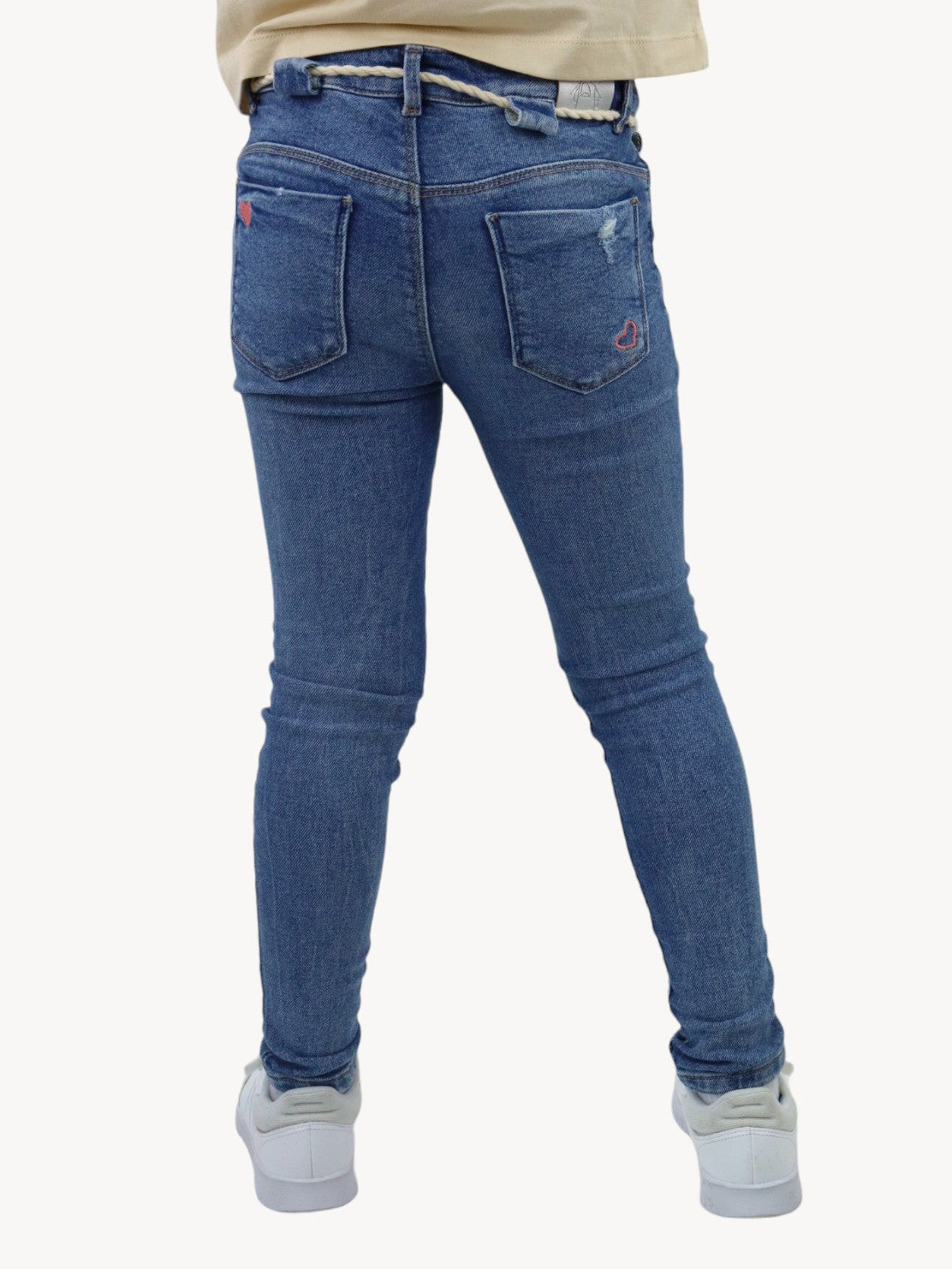 Jeans skinny con destrucción azul medio