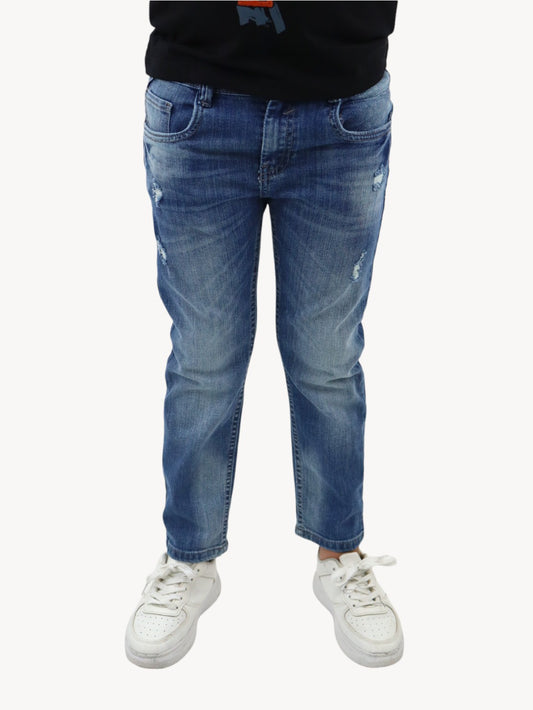 Jeans slim azul deslavado con destrucción