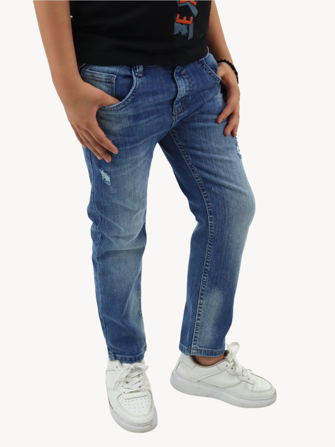 Jeans slim azul deslavado con destrucción