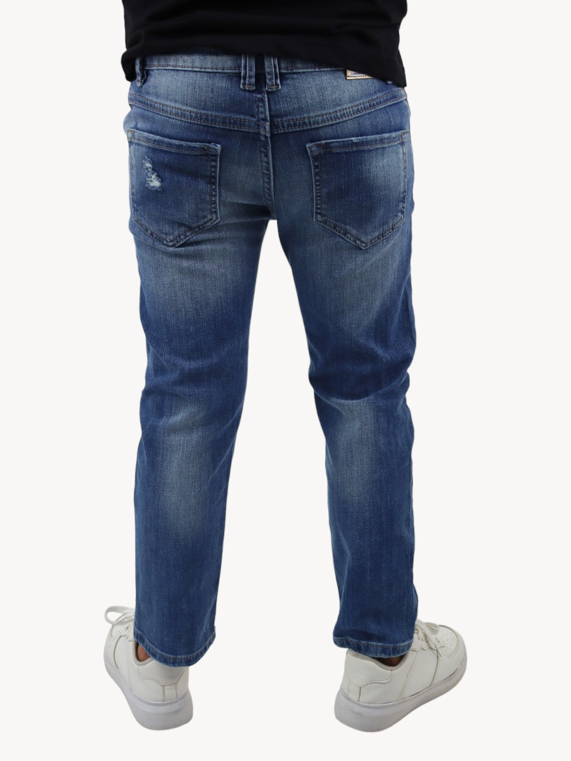 Jeans slim azul deslavado con destrucción