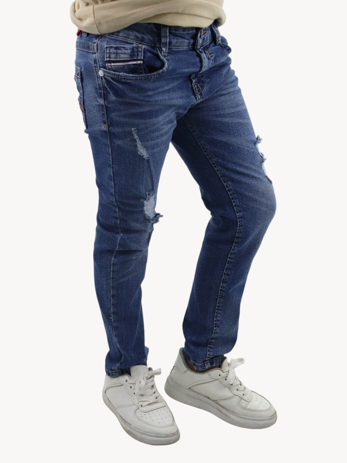 Jeans slim azul deslavado con destrucción