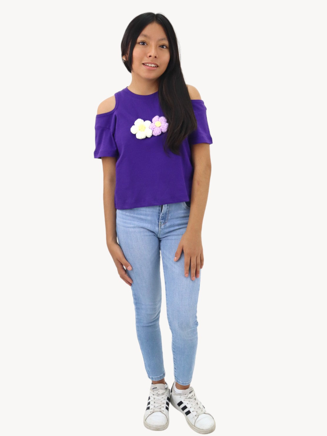 Jeans skinny con bordado floral