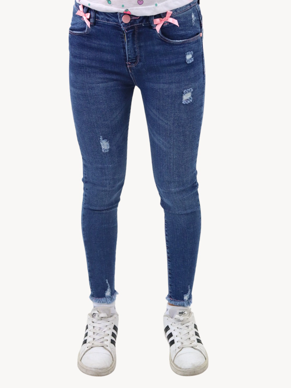 Jeans tobillero azul oscuro con destrucción