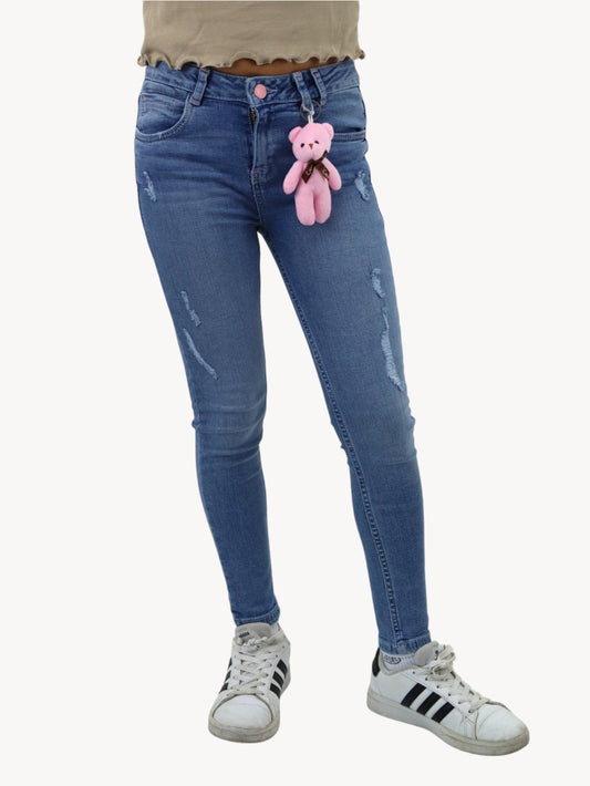 Jeans skinny con colgante decorativo