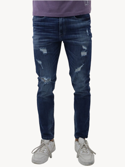 Jeans slim/skinny azul oscuro deslavado con destrucción