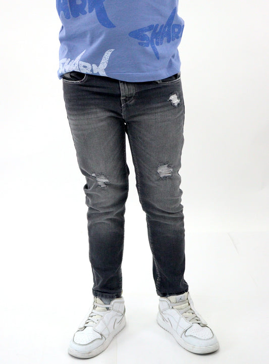 Jeans skinny de color gris oscuro con destrucción