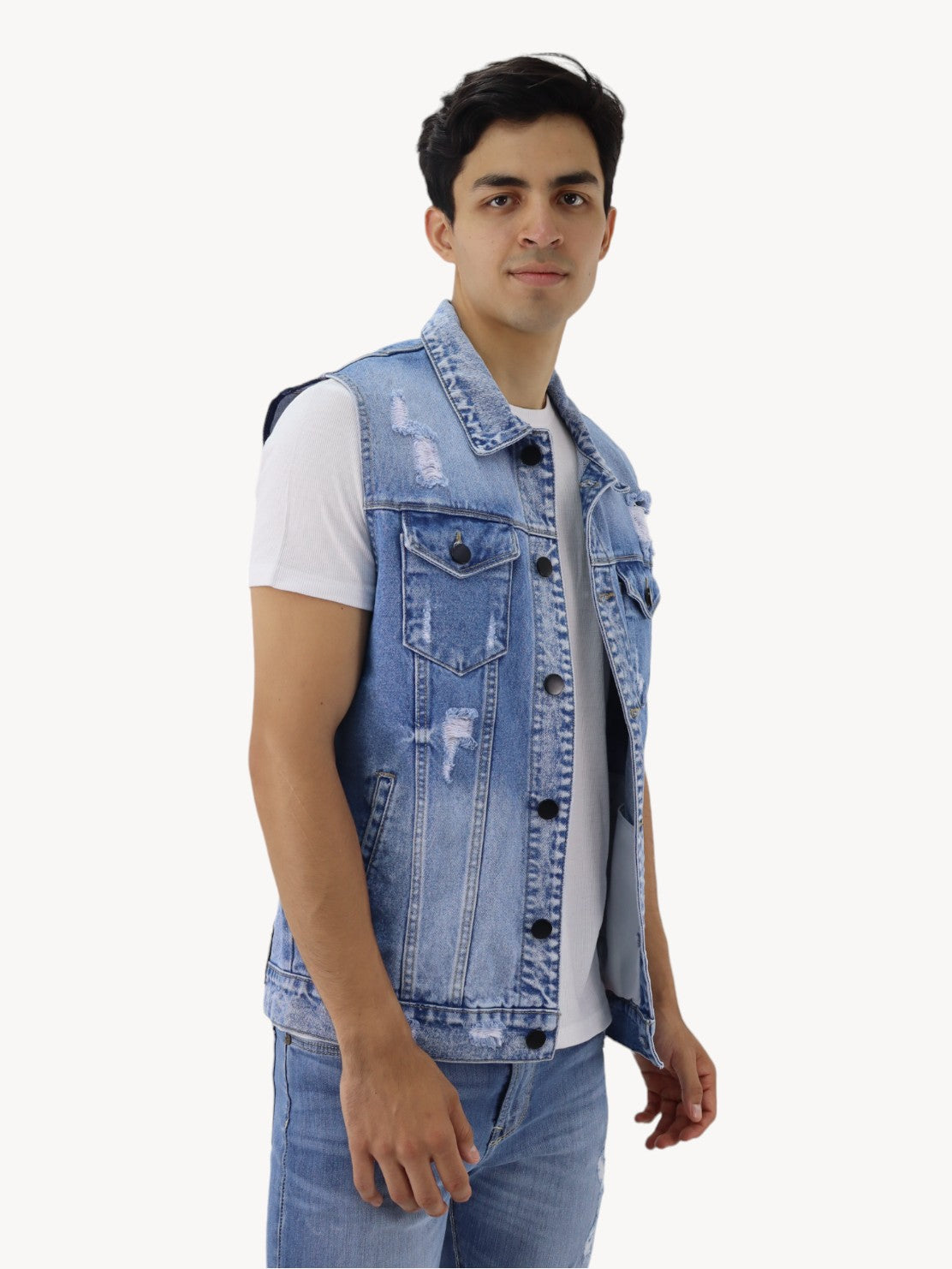 Chaleco denim de color azul medio con destrucción