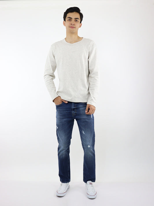 Jeans slim fit azul oscuro con destrucción