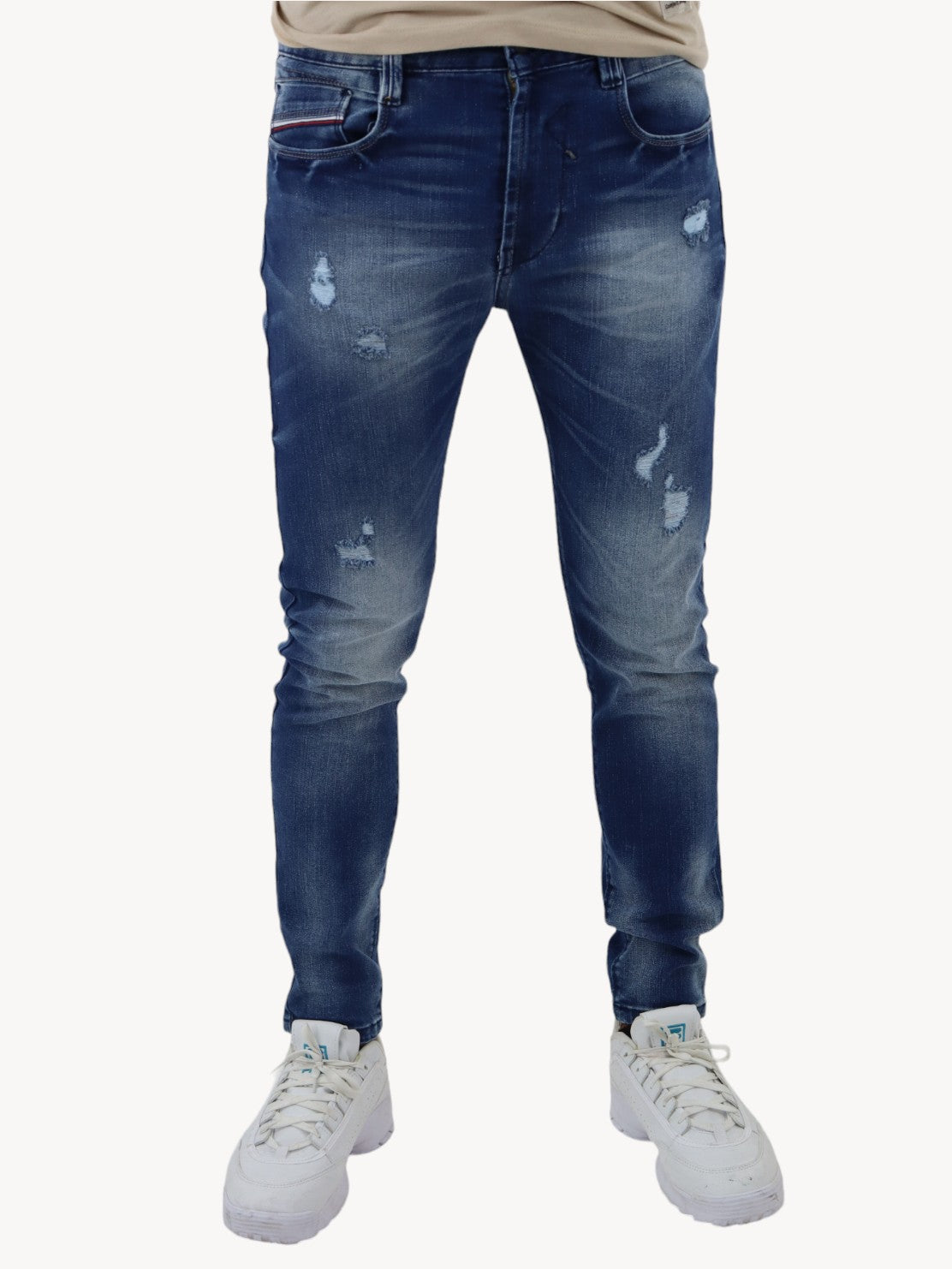 Jeans skinny azul oscuro con destrucción