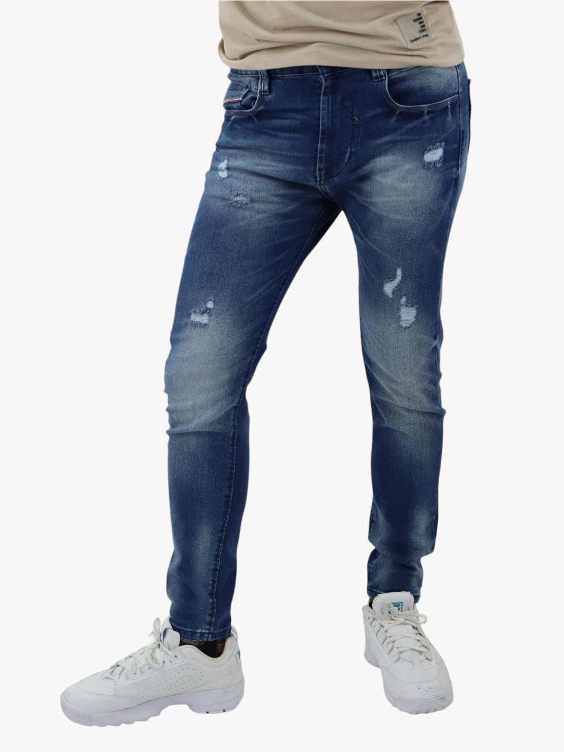 Jeans skinny azul oscuro con destrucción