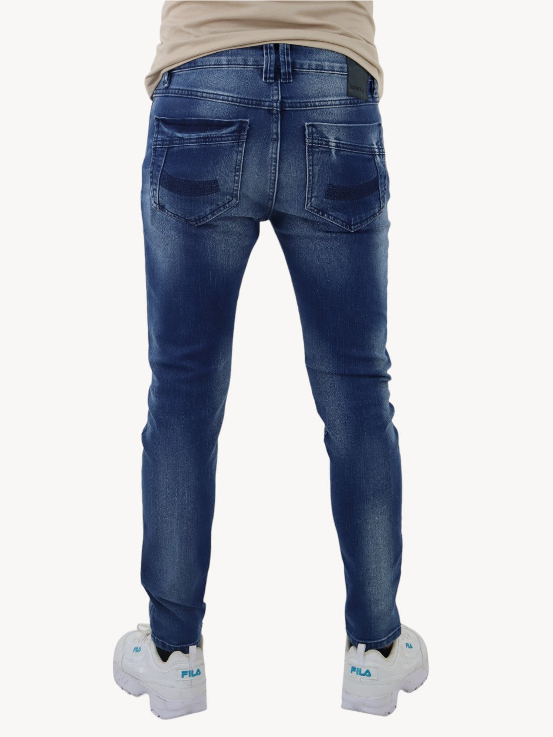 Jeans skinny azul oscuro con destrucción