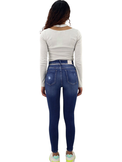 Jeans skinny tiro alto con destrucción