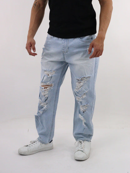 Jeans loose con destrucción y estampado