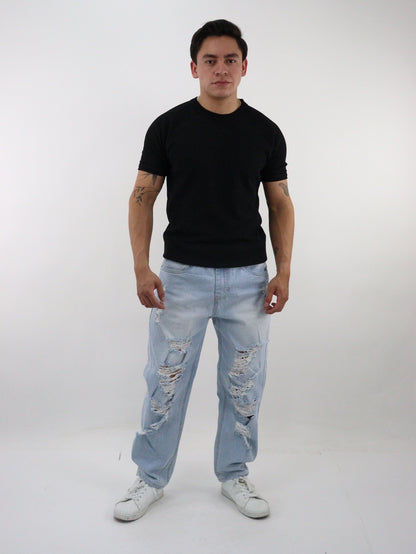 Jeans loose con destrucción y estampado