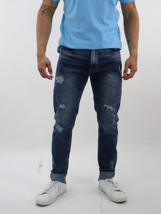 Jeans skinny color azul azul deslavado con destrucción