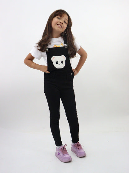 Overol denim de color negro con oso decorativo