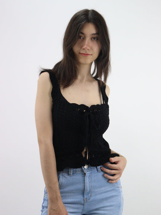 Blusa tejida con cordón ajustador de color negro