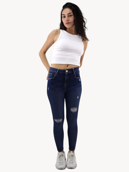 Jeans skinny tiro alto con destrucción
