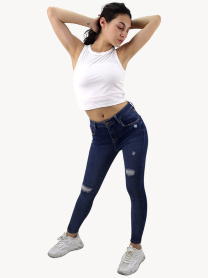 Jeans skinny tiro alto con destrucción