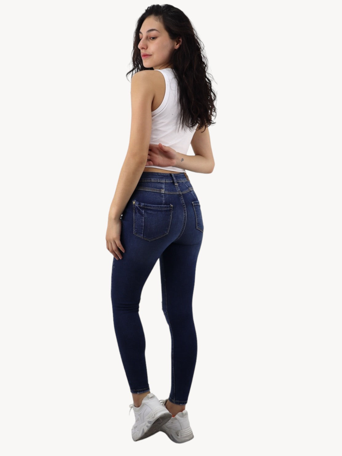 Jeans skinny tiro alto con destrucción