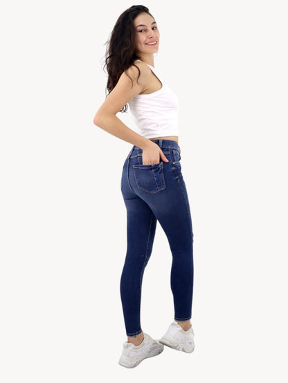 Jeans skinny tiro alto con destrucción
