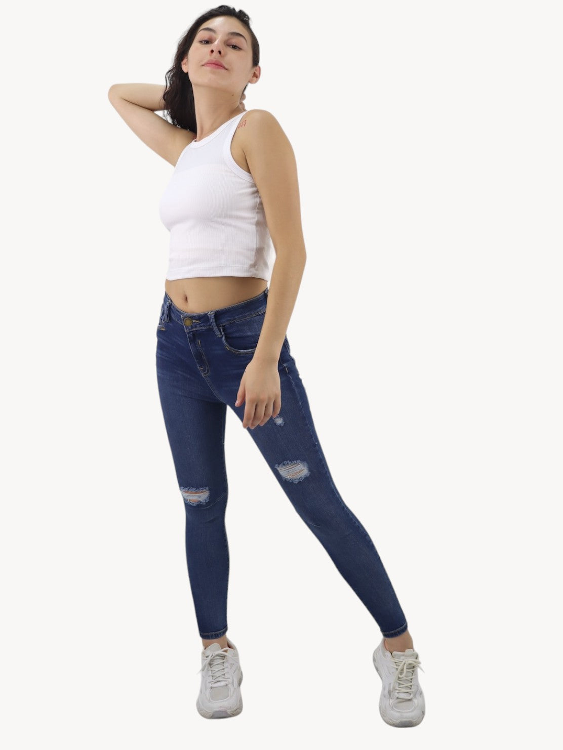 Jeans skinny tiro alto con destrucción