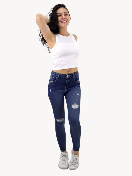 Jeans skinny tiro alto con destrucción