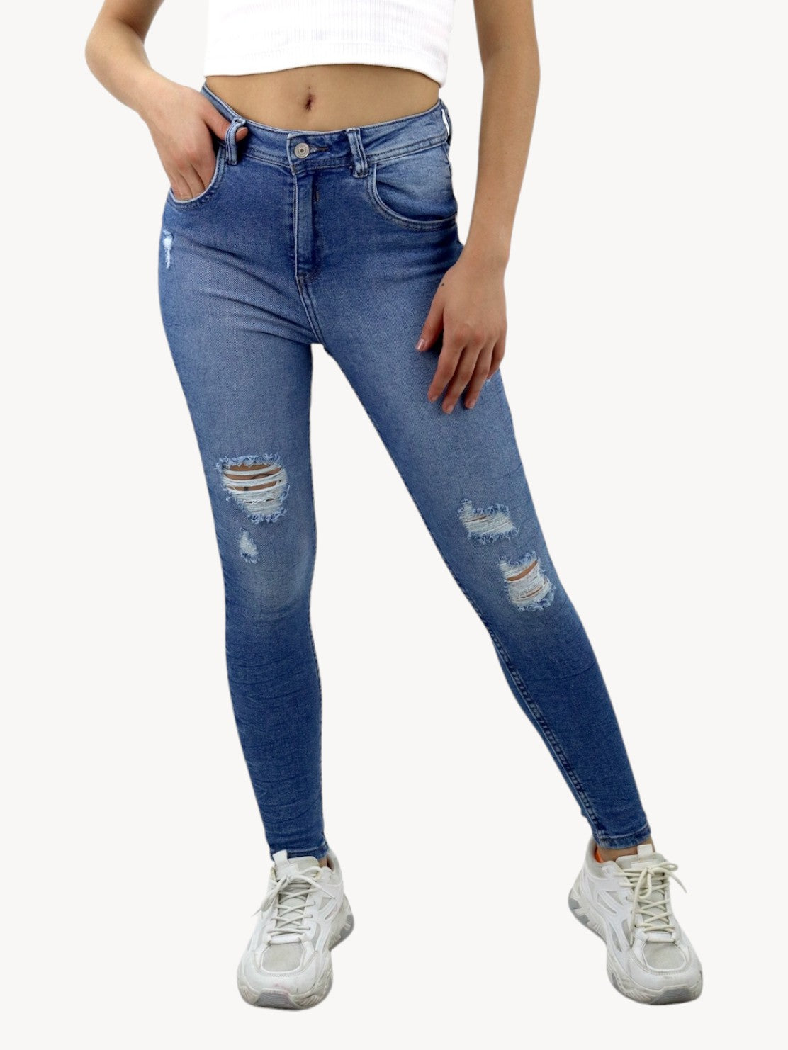 Jeans skinny tiro alto de color azul medio con destrucción