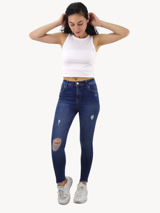 Jeans skinny azul oscuro con destrucción