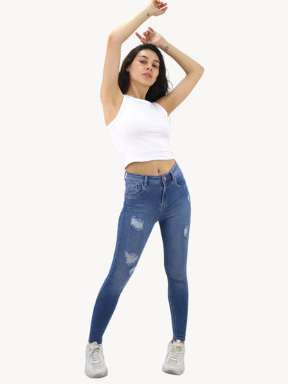 Jeans skinny de color azul medio con destrucción