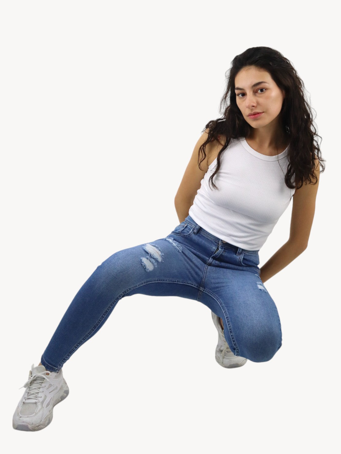 Jeans skinny de color azul medio con destrucción