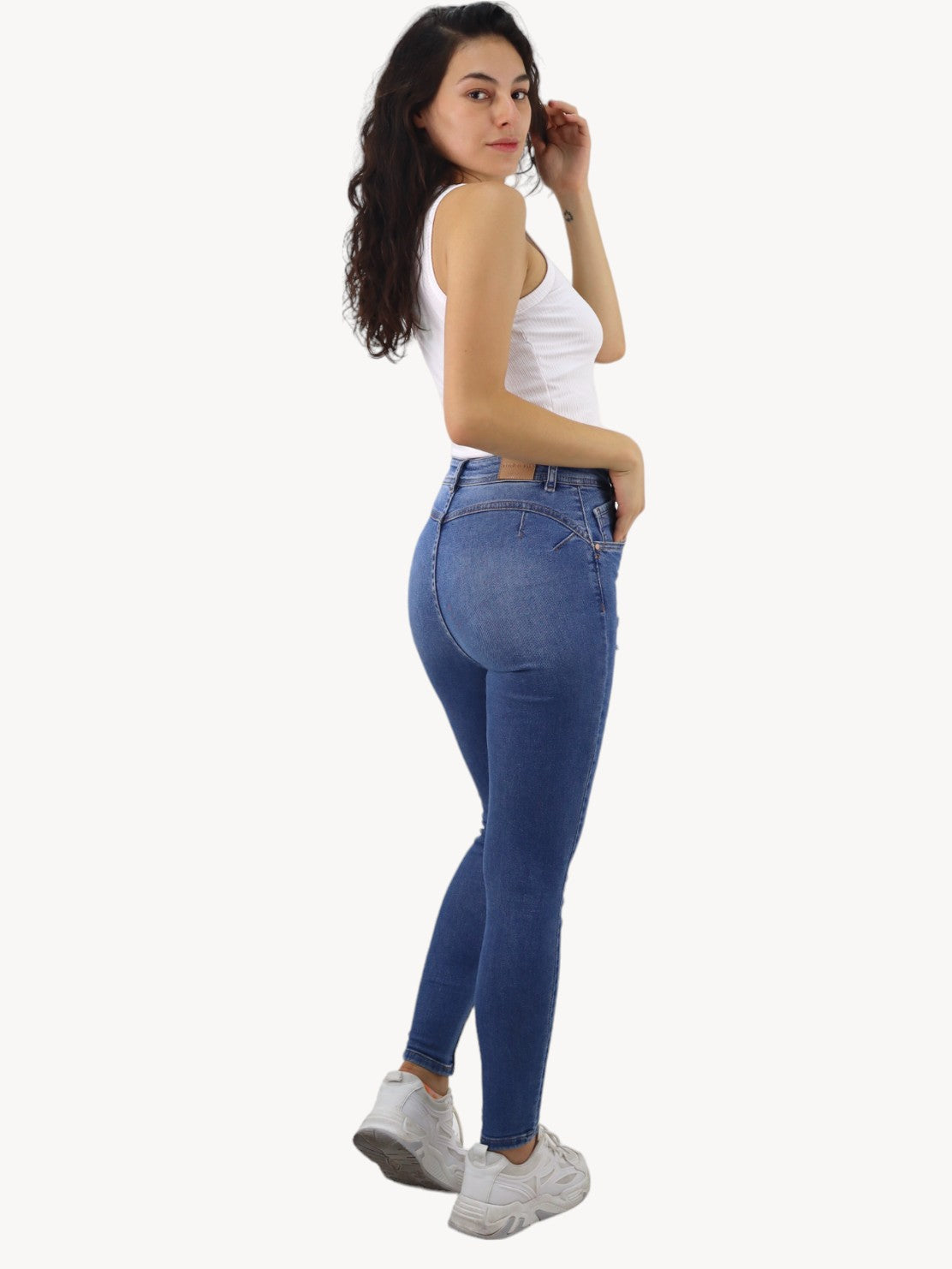 Jeans skinny de color azul medio con destrucción