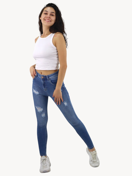 Jeans skinny de color azul medio con destrucción