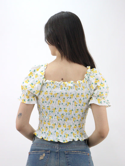 Blusa corta con estampado floral de manga farol con nudo delantero